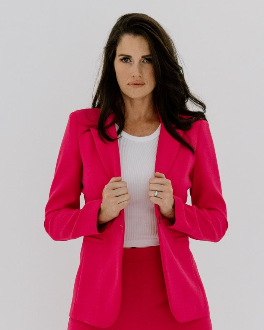 Jane McNeill in a pink suit